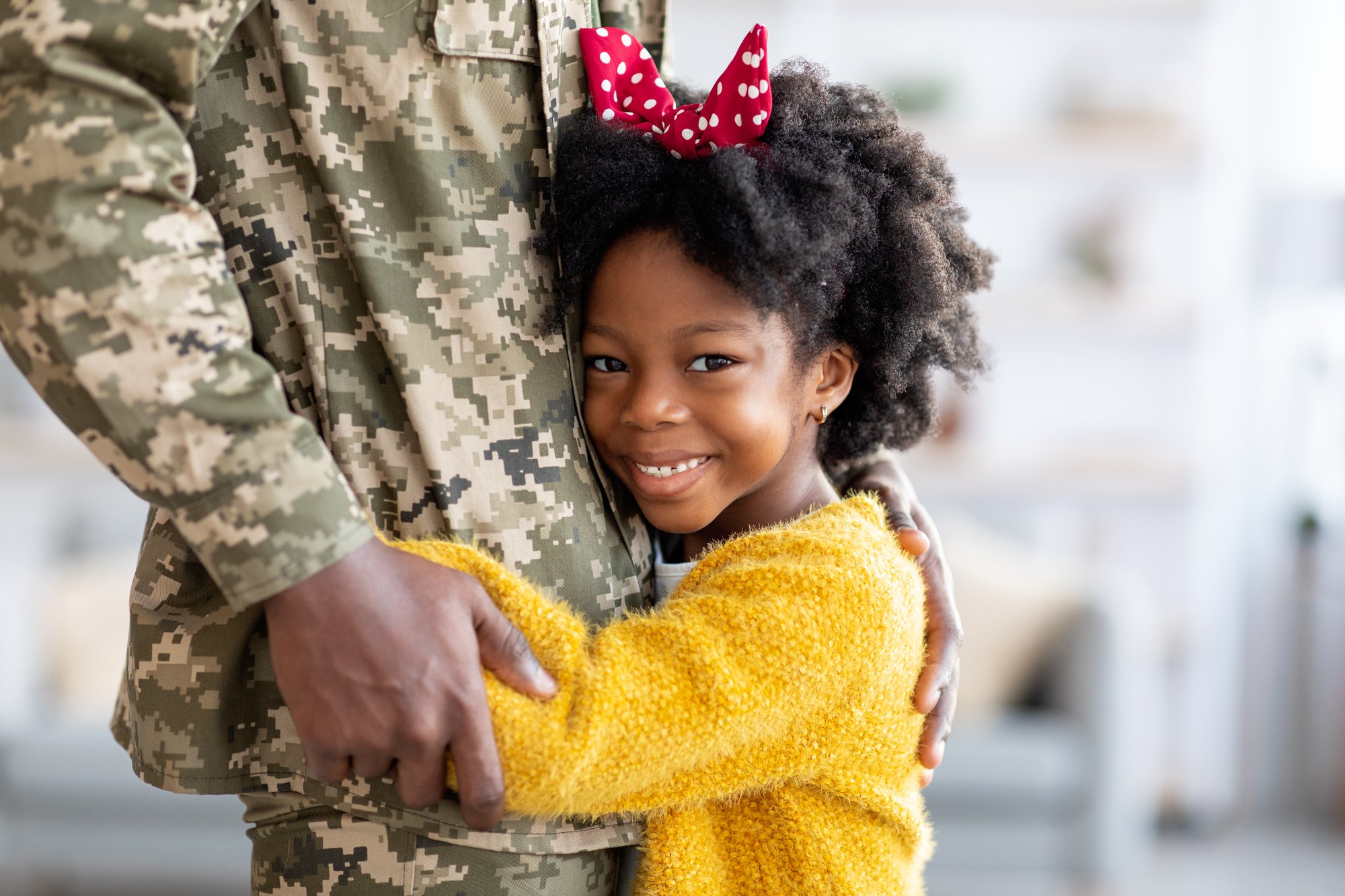 little-black-girl-embracing-dad-in-military-unifor-2023-11-27-05-01-04-utc