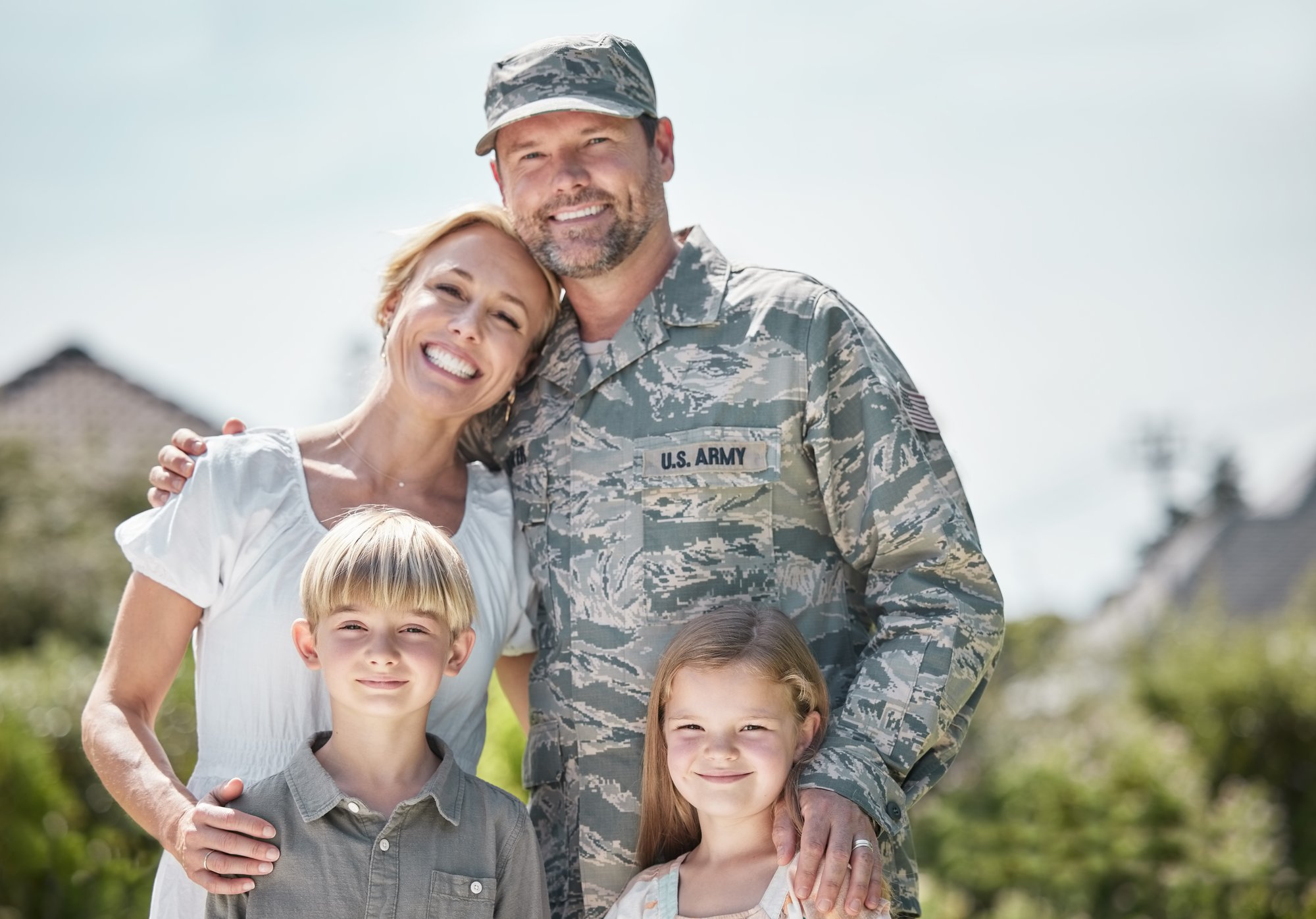shot-of-returning-soldier-standing-with-his-family-2023-11-27-05-23-54-utc